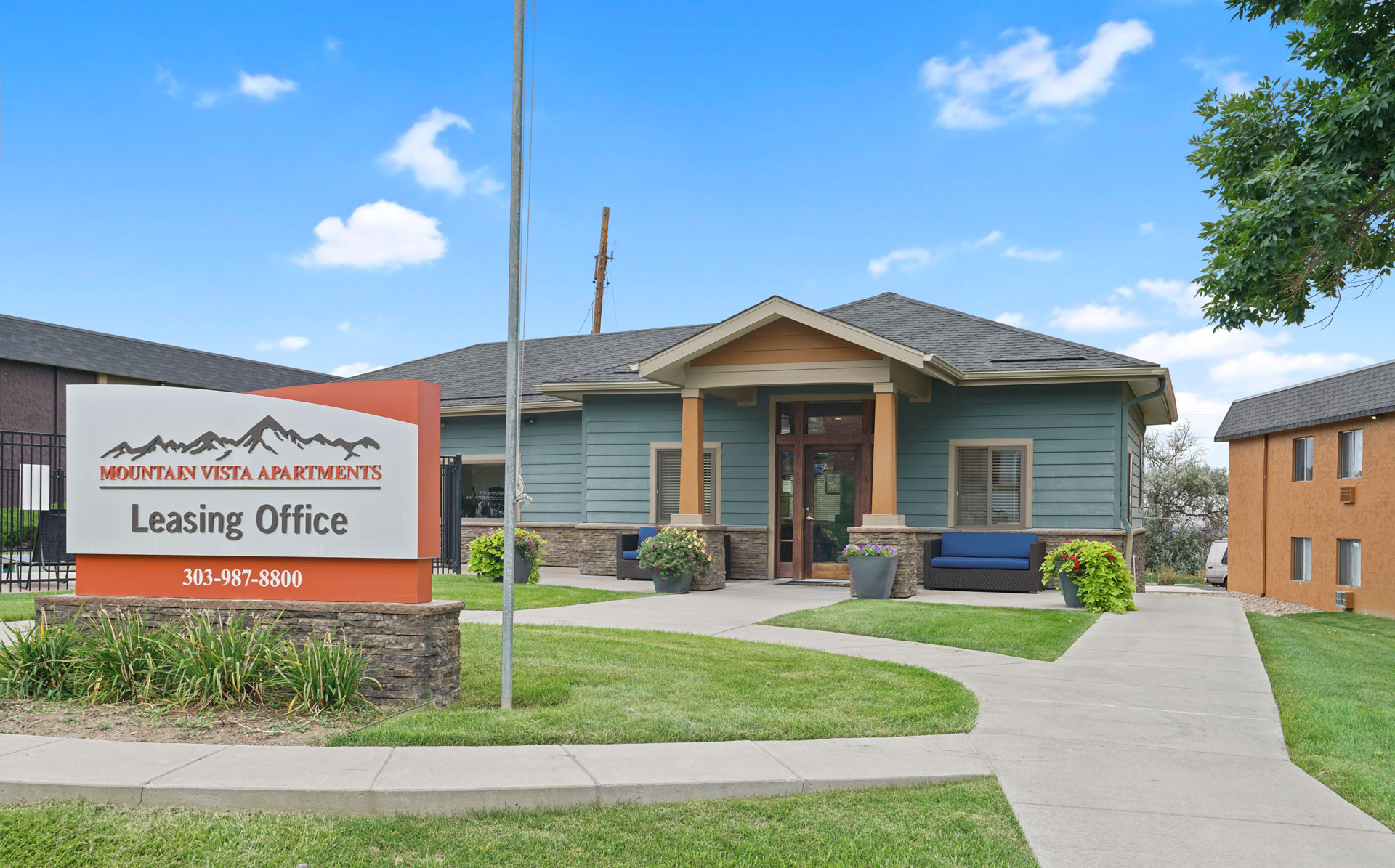 A leasing office for Mountain Vista Apartments is shown with a sign in front of the building.