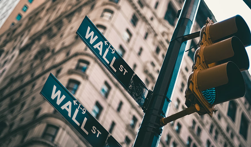 Close-up shot of the Wall Street sign in New York City.