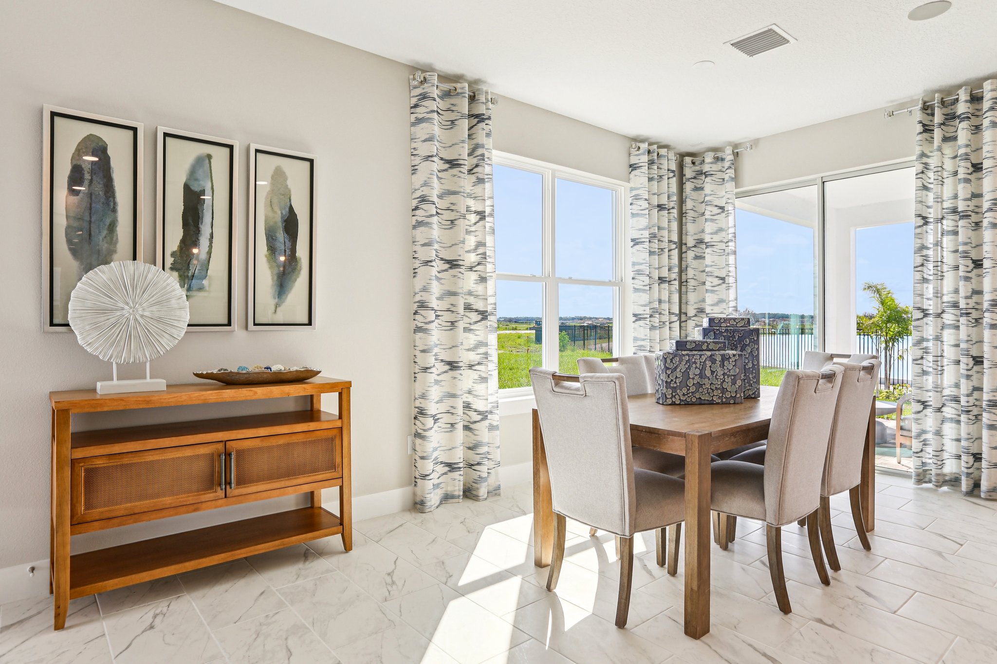 The Dining Room of a DRB Homes Bimini Model at Isla Mirada in San Antonio, FL. 