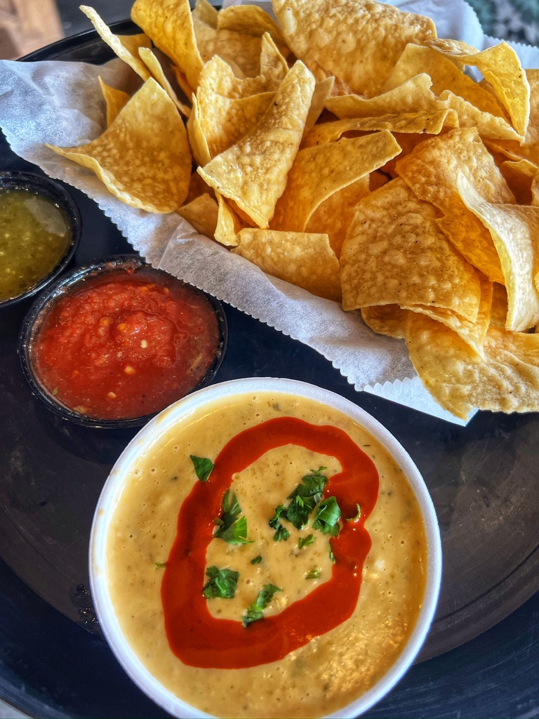 Chips fried fresh in house daily, salsa, and house made queso 