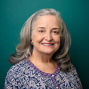 Female internal medicine doctor professional headshot.