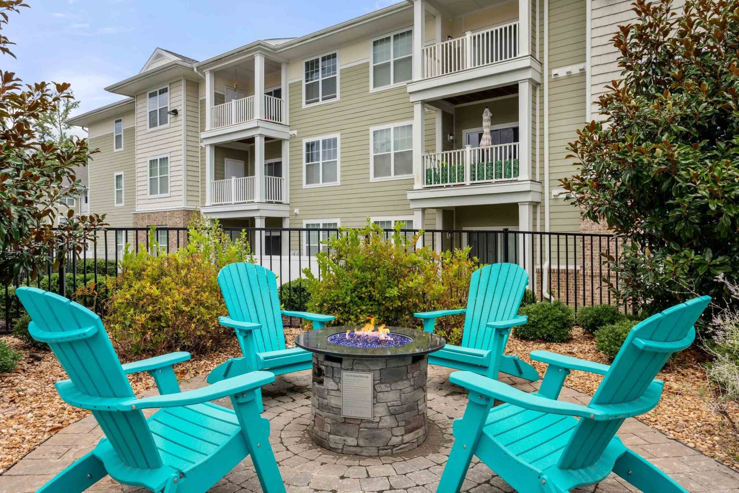 Fire pit seating area with turquoise chairs