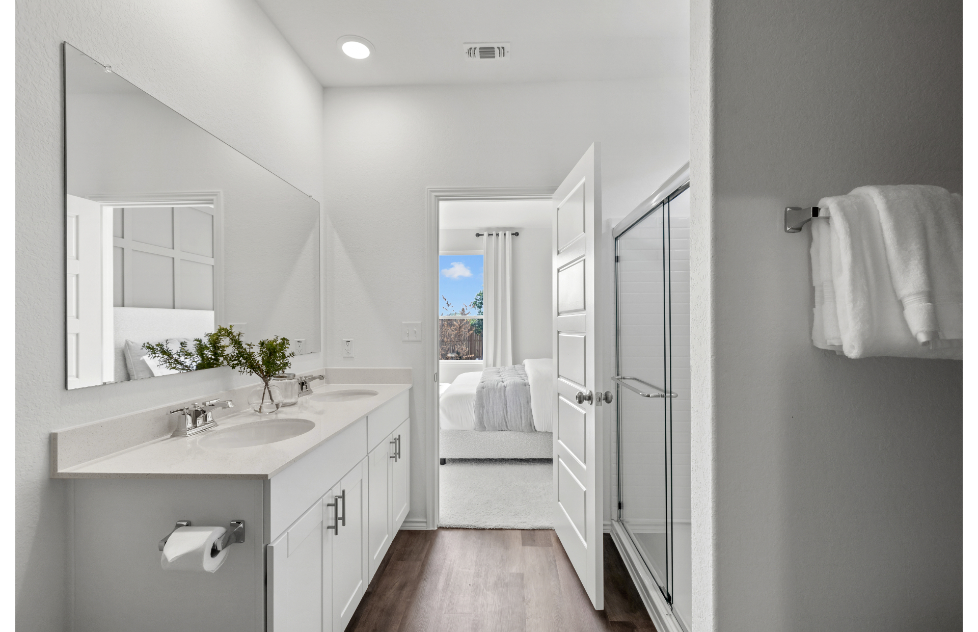 Owner's bathroom with double vanity and walk-in shower in new homes in Vista Real at Converse, TX