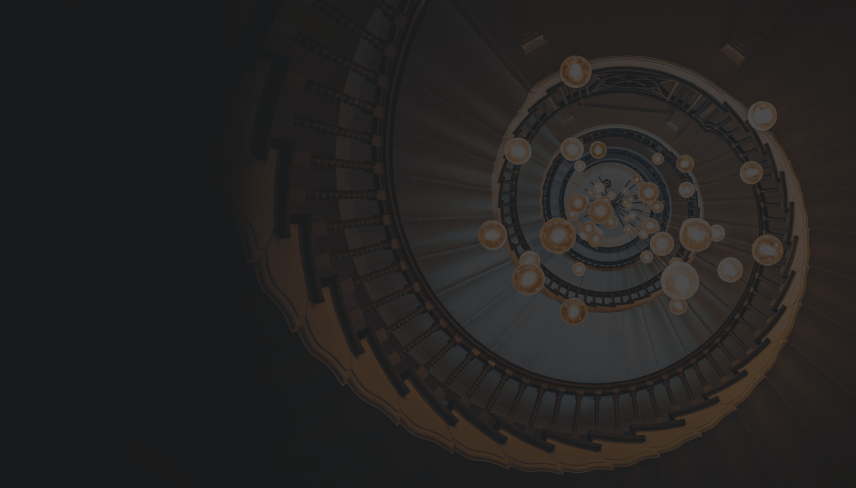 A bottom-up view of a spiral staircase and chandelier.