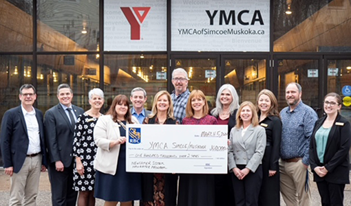 Members of The Madison Group presenting a giant cheque to YMCA of Simcoe Muskoka.