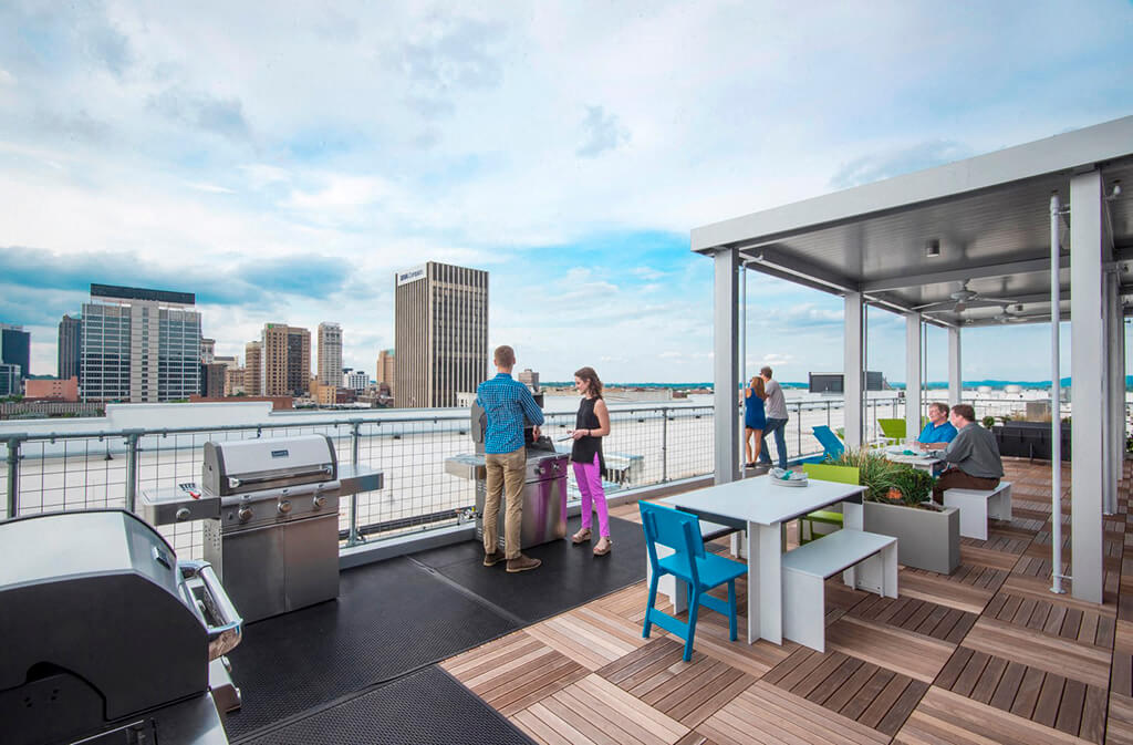 Rooftop terrace with outdoor grills and seating areas