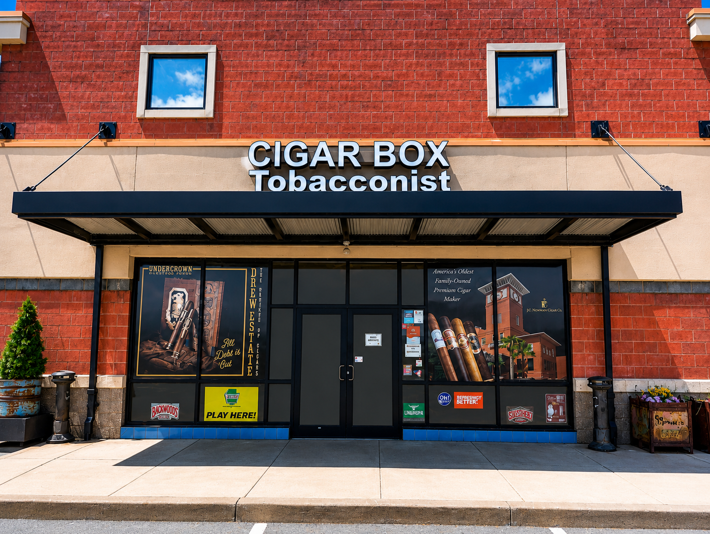 Discover a welcoming cigar shop featuring a wide selection of premium cigars, quality tobacco products, cigar accessories, and vape products. The clean, modern storefront offers a convenient destination for customers seeking exceptional service and a premium shopping experience.
