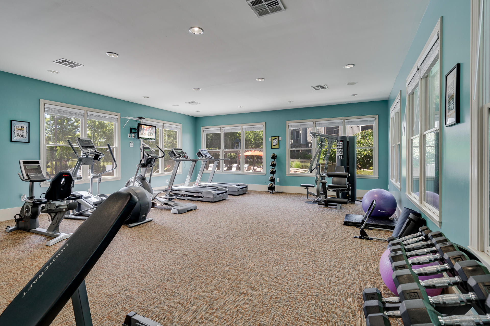 Fitness Center Overlooking The Pool & Sundeck