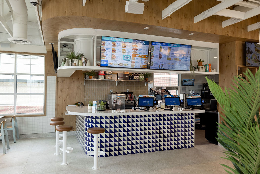 Interior of Birdcall McKinney showing off the ordering system and menus near the bar.
