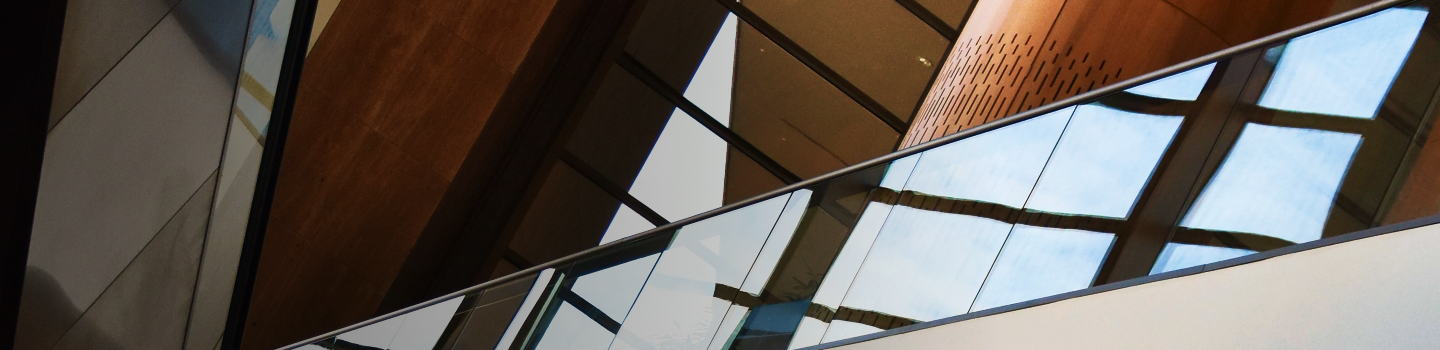 Close up, abstract view of a modern building with wooden accents.