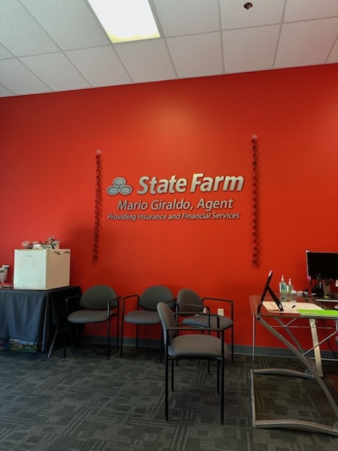 Celebrating the holidays at Mario Giraldo's State  Farm office!