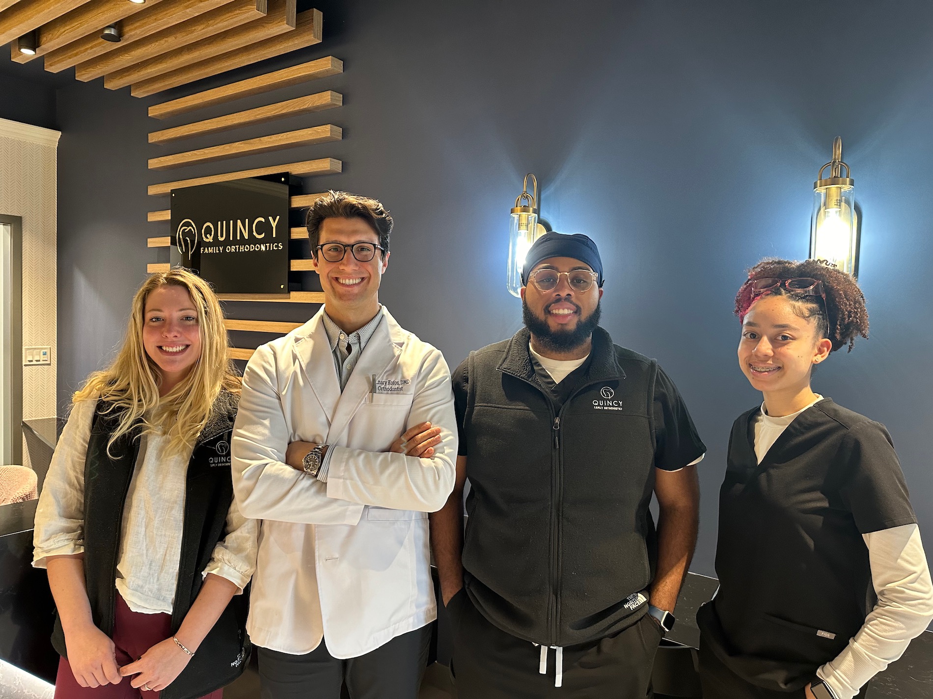 Quincy Family Orthodontics located in Quincy, MA offers leading-edge care in a welcoming and fun environment. With advanced options, we create beautiful, healthy and confident smiles: efficiently, affordably, and comfortably!
Dr. Zachary Kofos and our expert team take pride in our brand-new facility, equipped with state-of-the-art orthodontic technologies. As a patient-centered and family-friendly practice, we take the time to learn our patients’ expectations and concerns, and work closely with families to design treatment that works for their lives.
We pride ourselves on going above and beyond to provide quality patient care. Orthodontic techniques and technologies are advancing to allow us to treat patients more quickly and gently, resulting in a more enjoyable experience overall. We offer a variety of modern orthodontic services for all ages, such as traditional metal, clear braces, early intervention and two-phase orthodontic treatment, Invisalign for children, teens and adults.