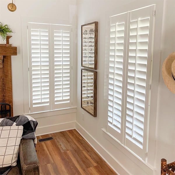 Shutters are an incredibly versatile window treatment that can be crafted to fit just about any sized window. Here, they help to accentuate the hardwood elements throughout this living room and provide unparalleled light control.