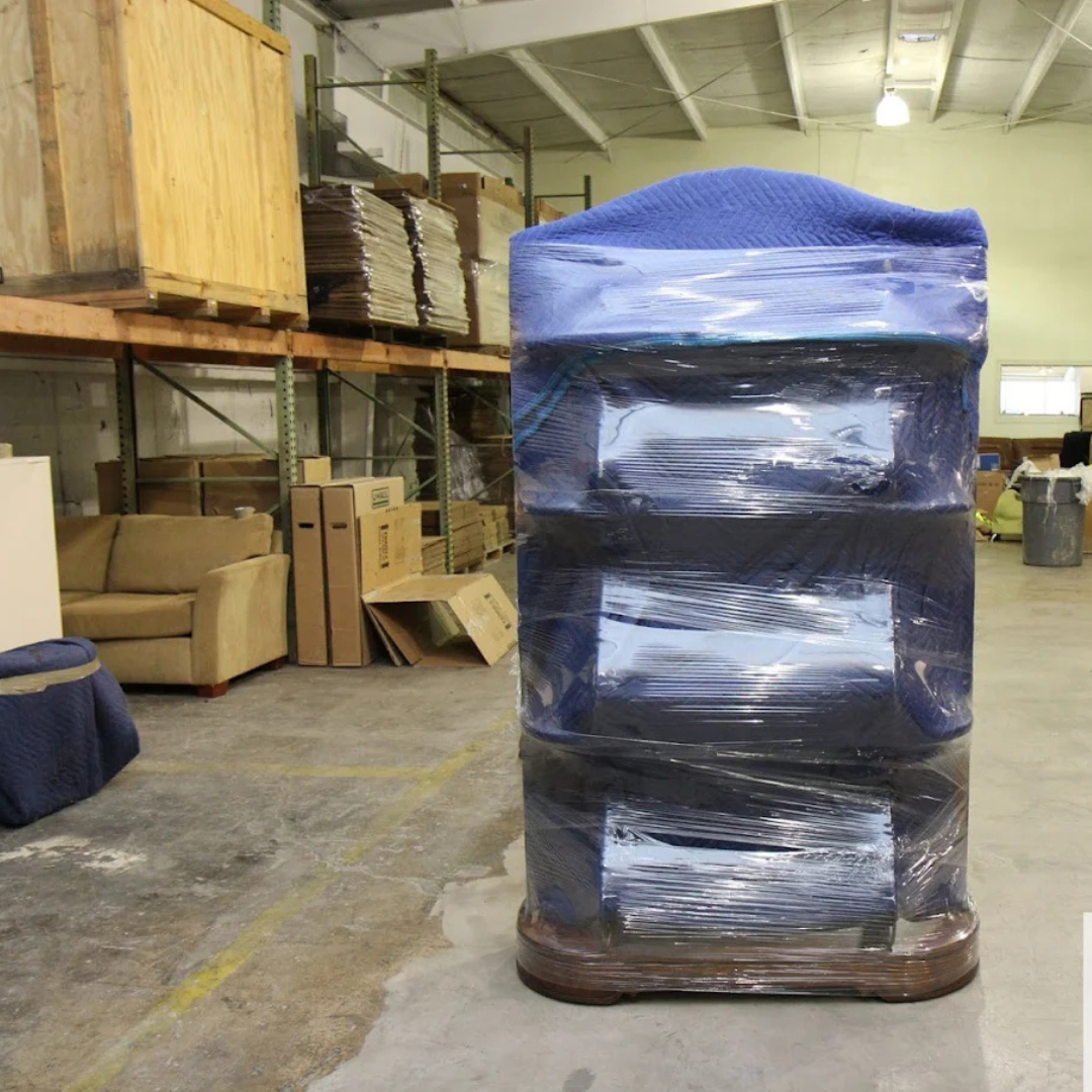 Wrapped and padded furniture secured for transport or storage by Econo Move & Storage, specialists i 