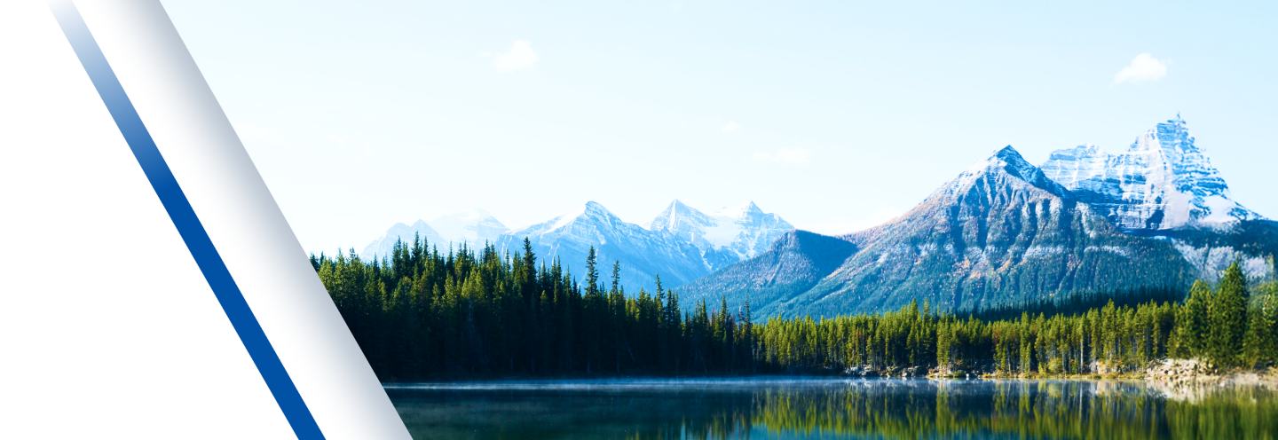 Mountains, trees, and a lake in British Columbia, Canada.