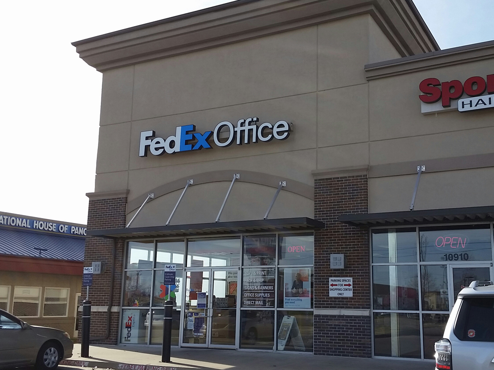 Exterior photo of FedEx Office location at 10912 E 71st St\t Print quickly and easily in the self-service area at the FedEx Office location 10912 E 71st St from email, USB, or the cloud\t FedEx Office Print & Go near 10912 E 71st St\t Shipping boxes and packing services available at FedEx Office 10912 E 71st St\t Get banners, signs, posters and prints at FedEx Office 10912 E 71st St\t Full service printing and packing at FedEx Office 10912 E 71st St\t Drop off FedEx packages near 10912 E 71st St\t FedEx shipping near 10912 E 71st St