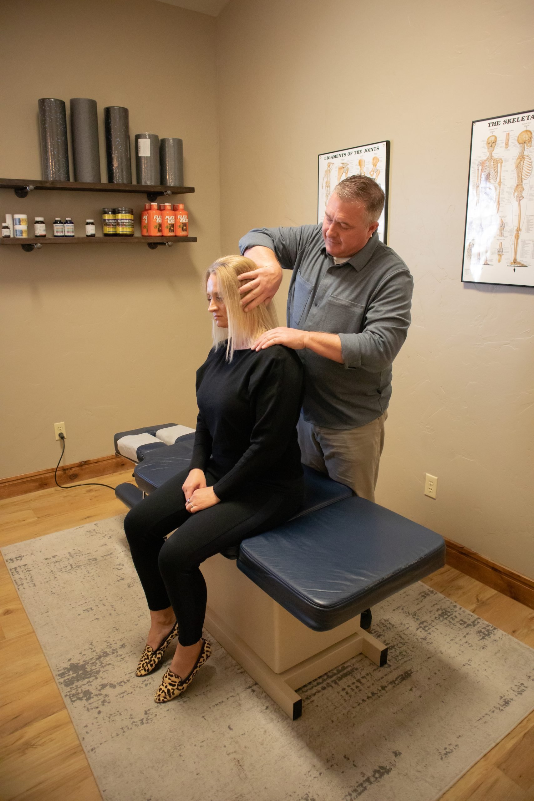 chiropractor working with patient