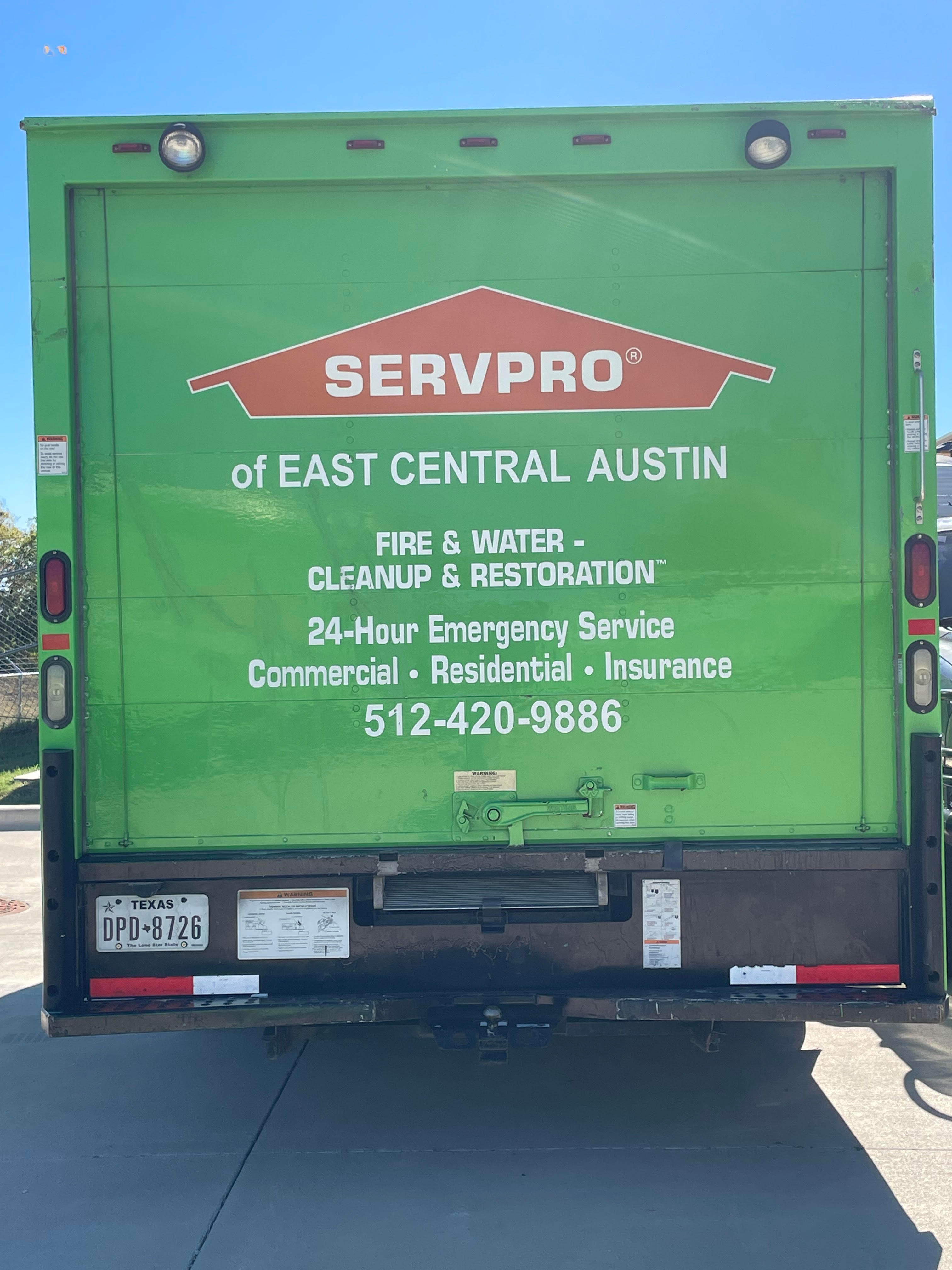A SERVPRO® emergency response vehicle parked outside of the storefront.