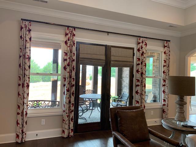 We love how great this combination of Drapery Panels and Woven Wood Shades looks in this house in Ma Budget Blinds of Knoxville & Maryville Knoxville (865)588-3377