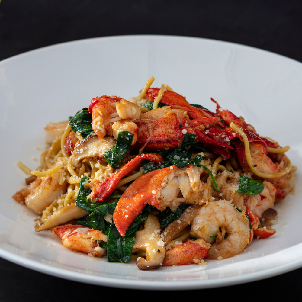 Lobster Garlic Noodles. Lobster Garlic Noodles - Maine lobster, shrimp, shiitake mushrooms, spinach and parmesan.