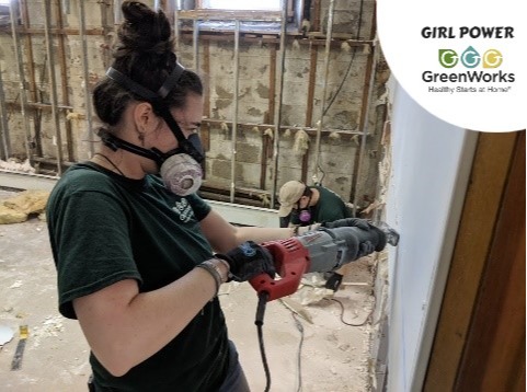Mold remediation photo showing a technician applying treatment to affected materials during professional cleanup.