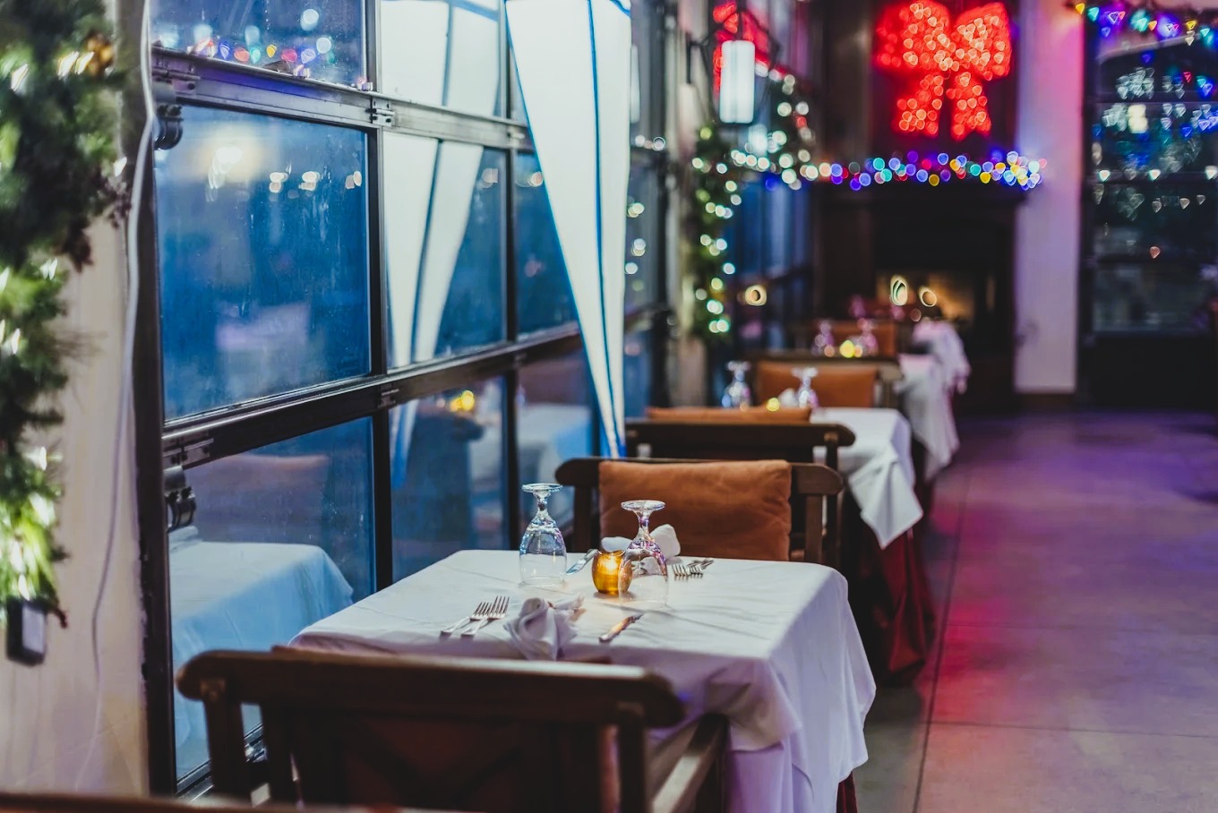 An intimate dining atmosphere with candlelit tables and warm décor, creating the perfect setting for 