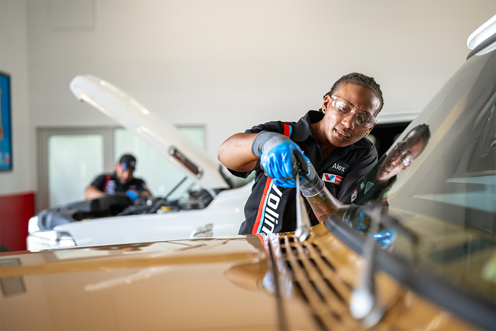 Valvoline technician replaces wiper blades on guest's truck during their visit to Valvoline.
