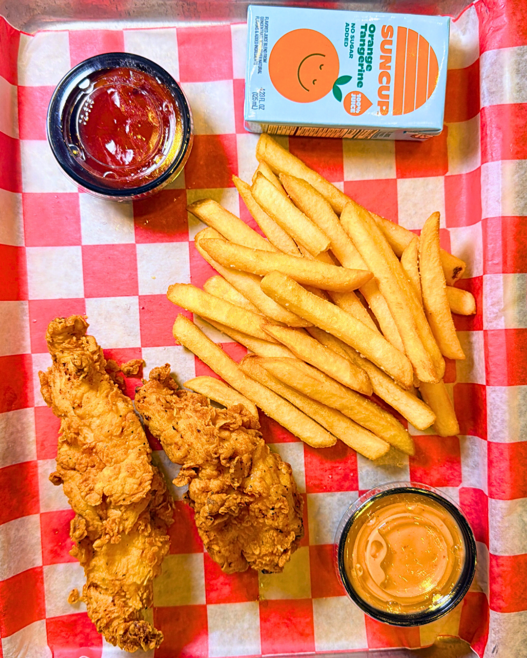 Hand breaded chicken tenders, fries, & juice box