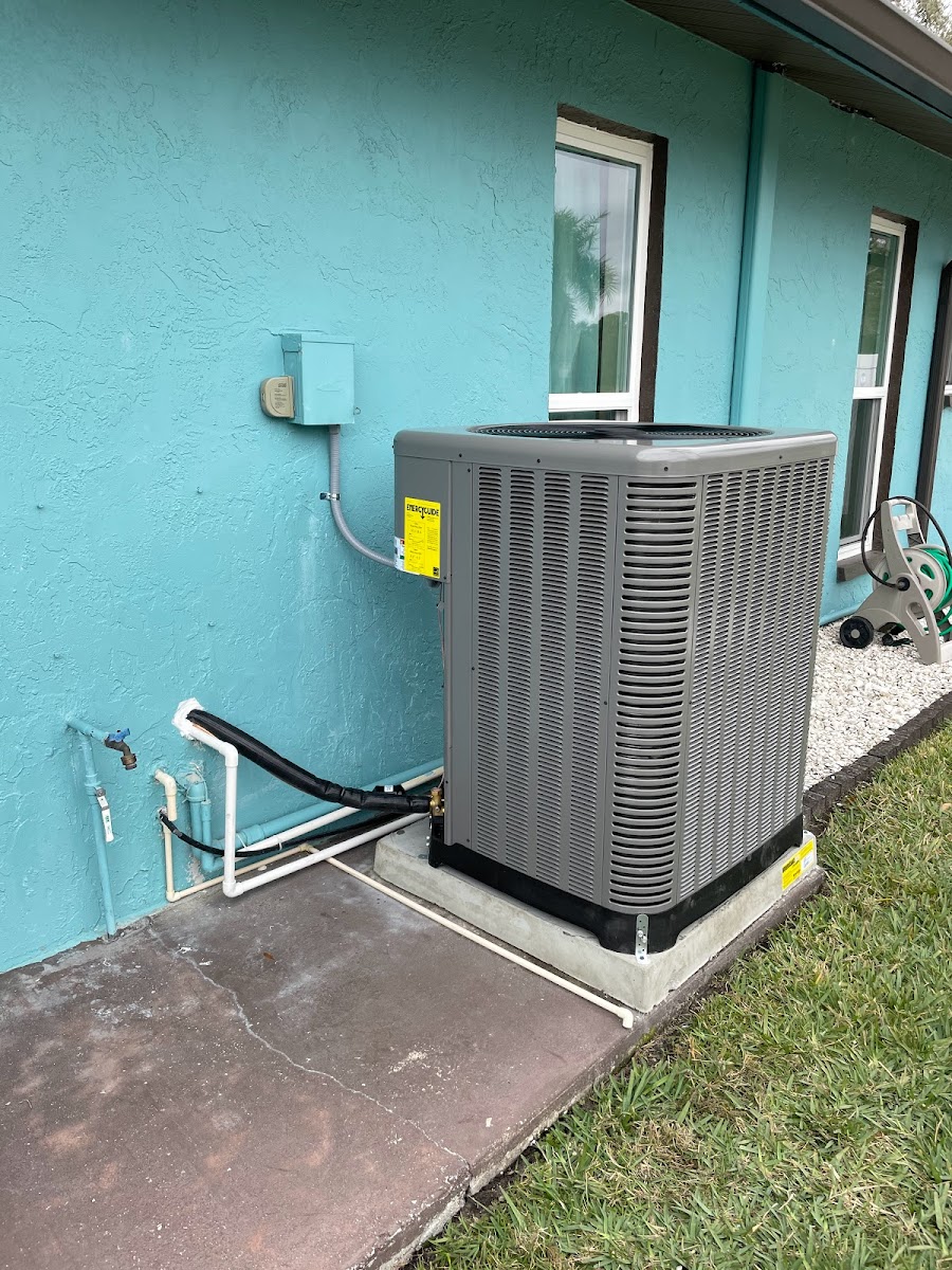 Outdoor air conditioning condenser unit installed for a residential property, providing reliable cooling performance for year-round comfort.