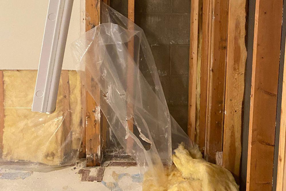 Pictured here, sheetrock is removed from the studs in a basement that experienced water damage in Minneapolis.  This is a critical part of the water damage cleanup process in Minneapolis.