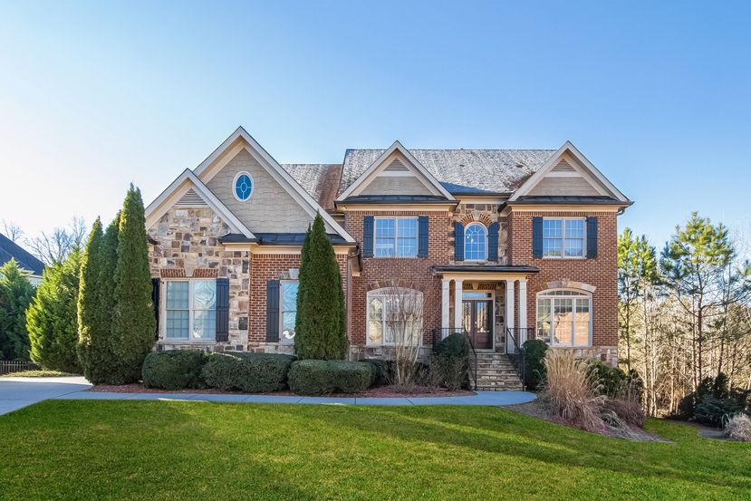 Stunning two-story home with beautiful landscaping at Invitation Homes Atlanta.