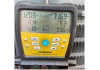 HVAC technician using digital manifold gauge to check refrigerant pressure for AC repair and diagnostics by Gotcha Heating and Air Inc in Spring Hill Florida