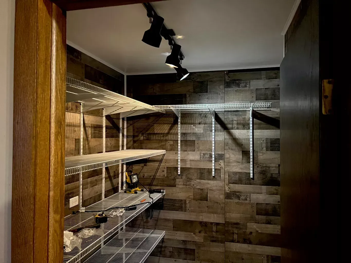 Custom pantry shelving installation maximizes storage with durable wire shelves, modern wall finishes, organized layouts, quality craftsmanship, efficient space utilization, and practical residential interior improvement solutions for homeowners.