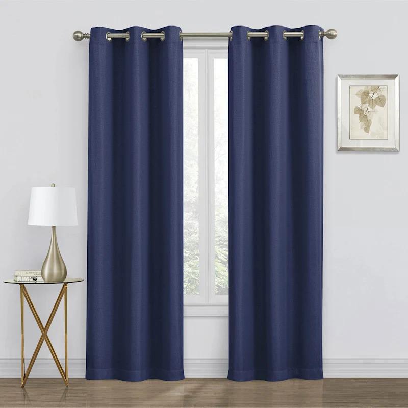 Two navy blackout grommet curtain panels, each measuring 84 inches in length, providing privacy and  At Home Wixom (248)675-0335