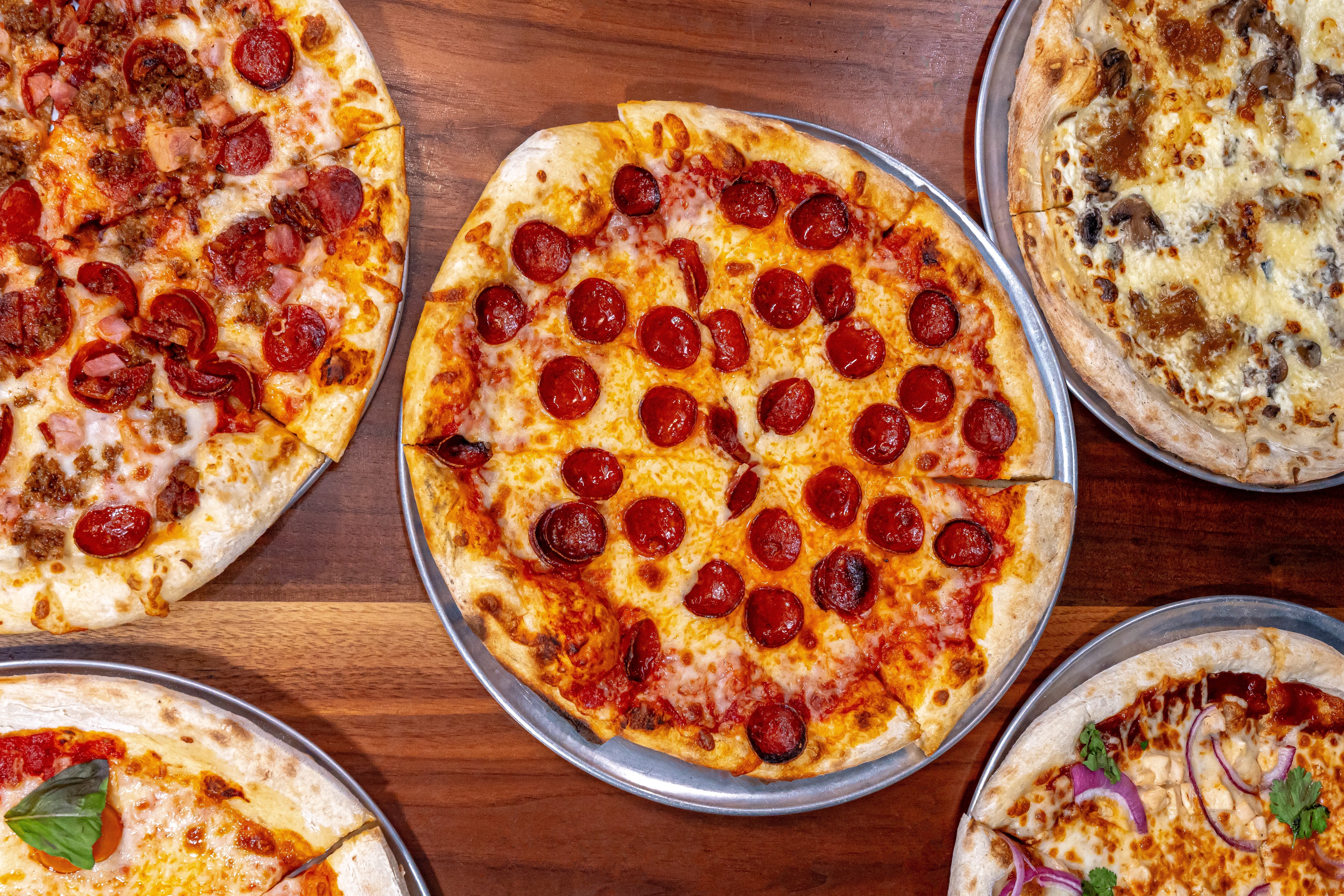Wood fired pizza at a sports bar in Dallas served hot and fresh from the oven.