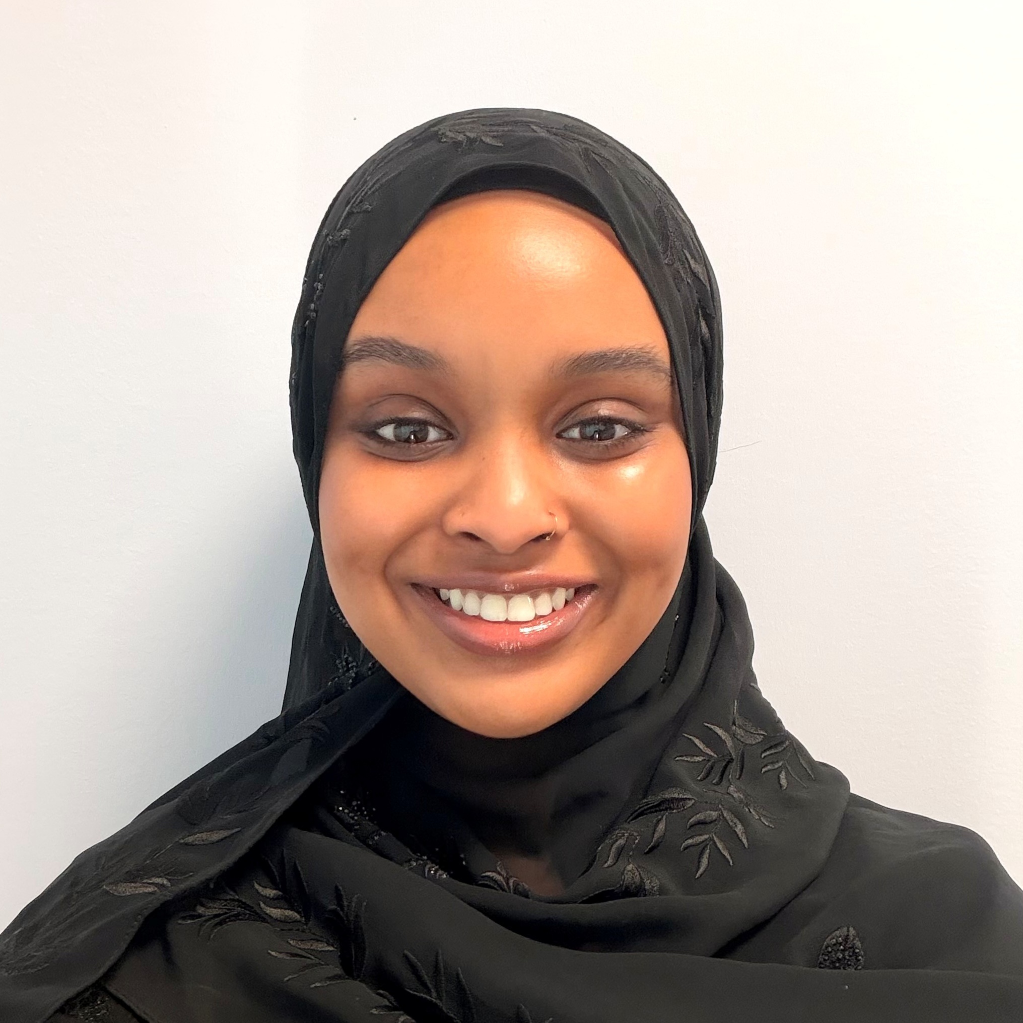 Aisha K., MA, LBA, IBA