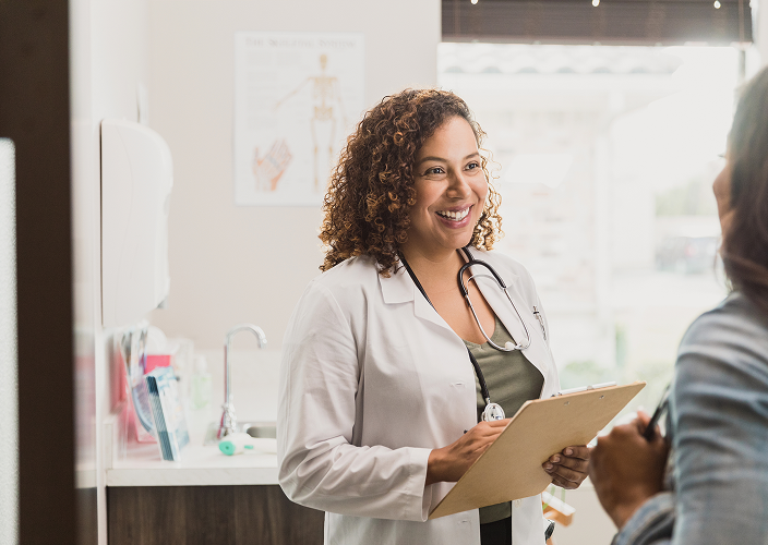 A doctor speaking with her patient.
