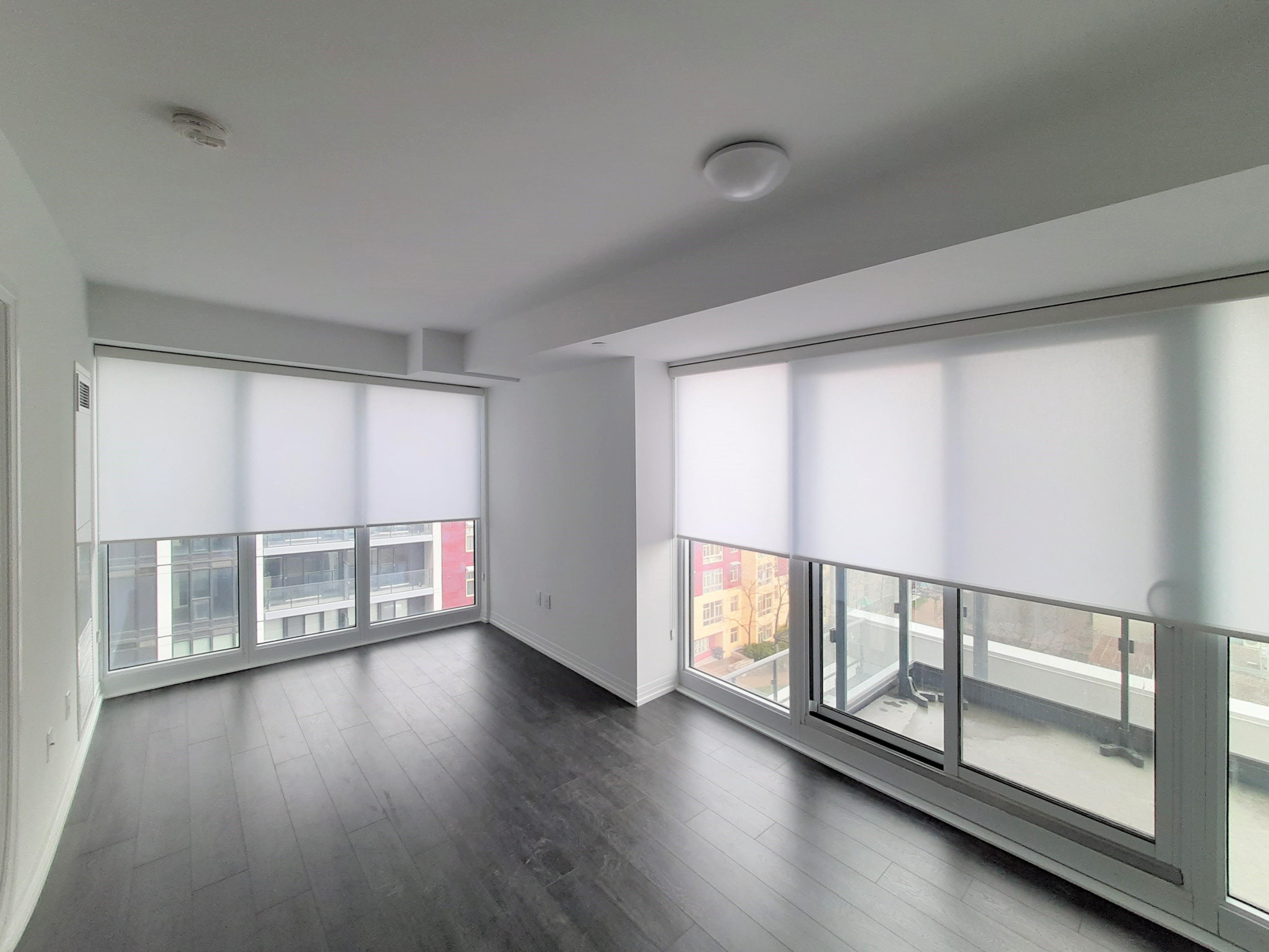 This Toronto Condo has light filtering roller shades that offer 100% privacy while giving a light an Budget Blinds of Southeast Toronto Toronto (416)243-0007