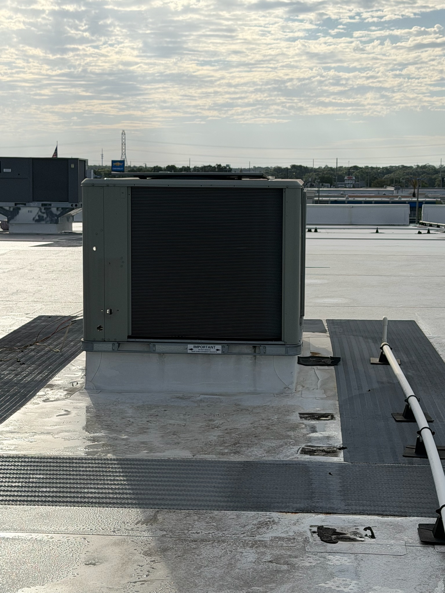 Commercial rooftop HVAC unit installed on a flat roof to provide reliable heating and cooling for th 