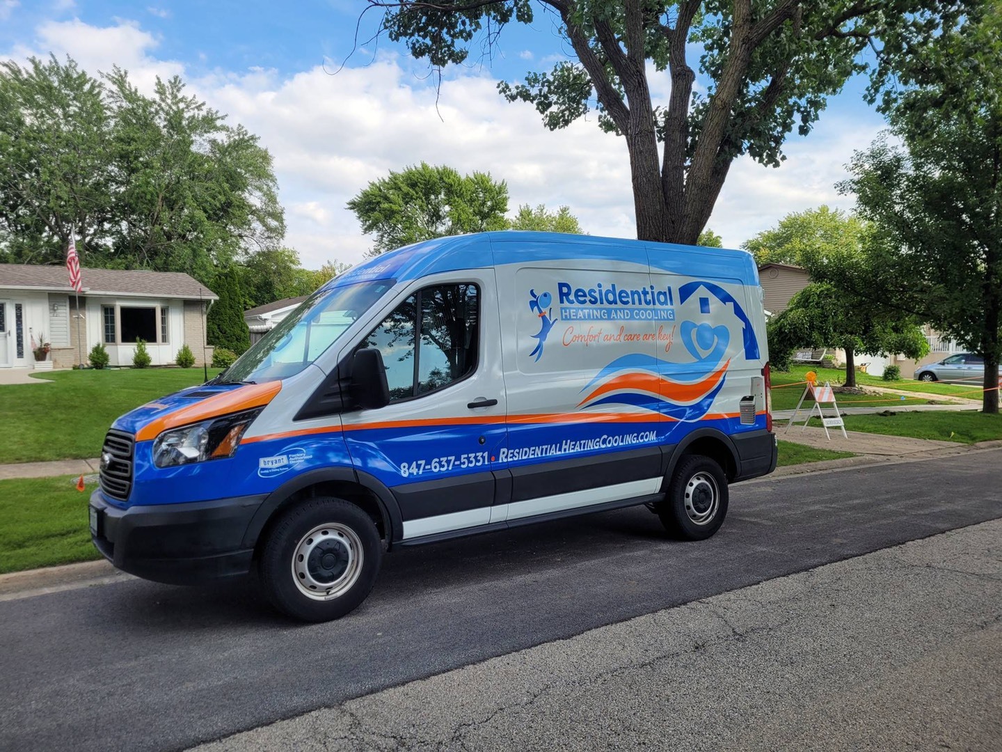 Residential Heating and Cooling Van parked in front of client home