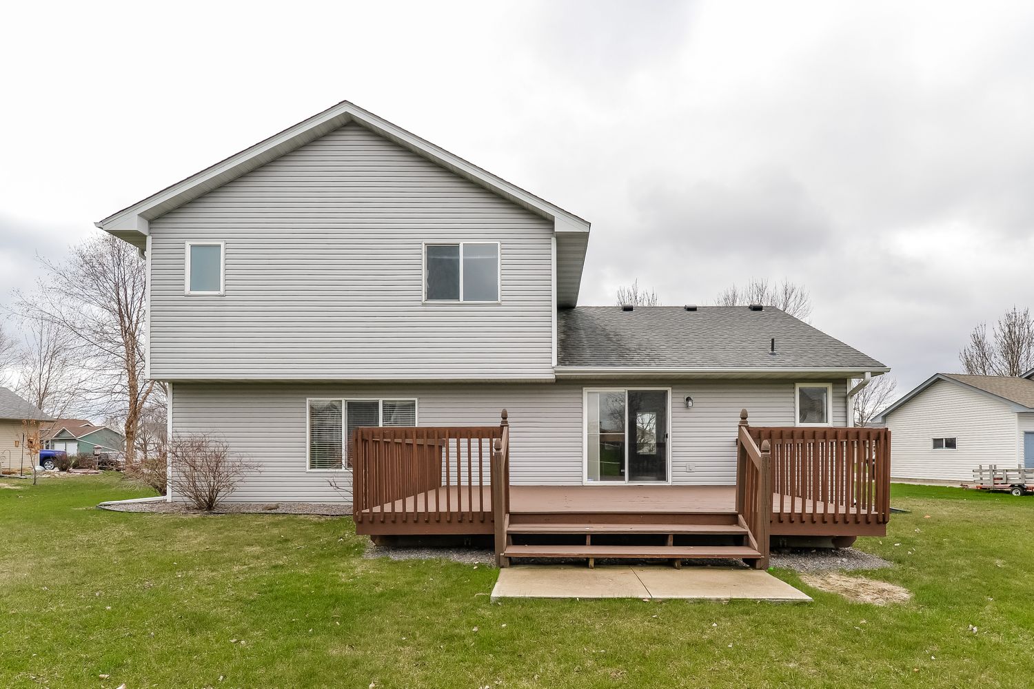 Beautiful backyard with an elevated deck at Invitation Homes Minneapolis.