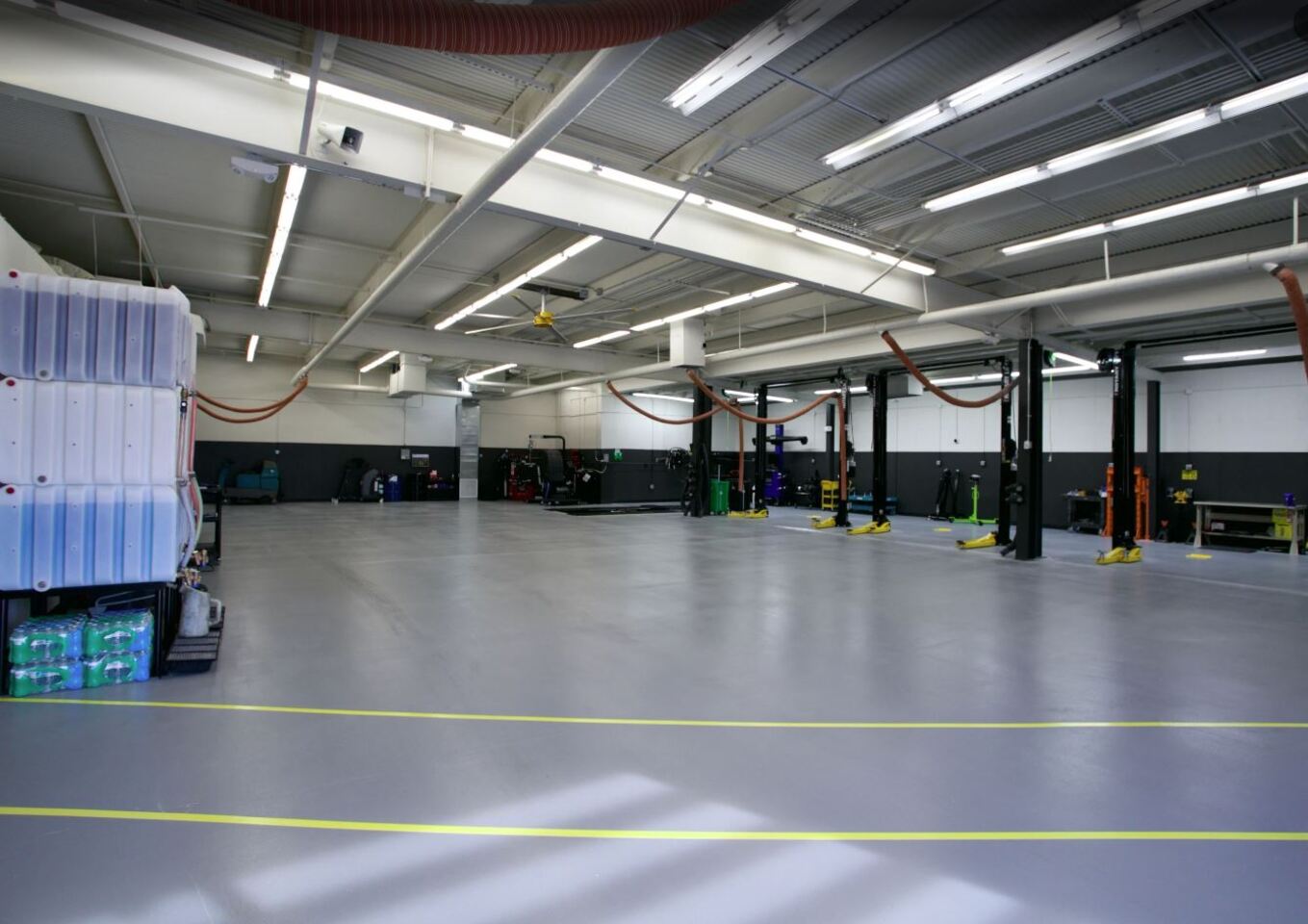 Automotive repair shop area inside Rob’e Mans Domestic Auto Repair in Homewood, Alabama featuring professional vehicle lifts, advanced diagnostic equipment, service bays, and ASE-certified technicians performing Domestic vehicle repair and maintenance services. The modern shop environment is designed to support high-quality automotive diagnostics, brake repair, transmission service, suspension work, oil changes, and preventive maintenance for Ford, Chevrolet, GMC, Dodge, RAM, Jeep, Chrysler, Cadillac, and Buick vehicles throughout Birmingham and Central Alabama.