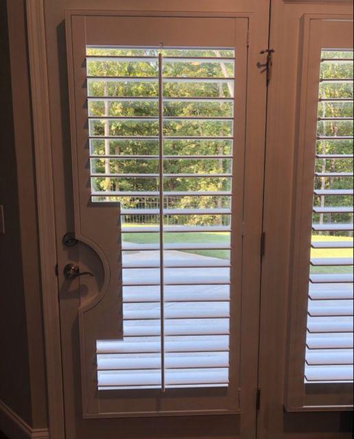 There's nothing our expert installation team can't do! We love how cool and functional these Shutters with a cutout look for these Dallas, GA patio doors. #BudgetBlindsKennesawAcworthDallas #Shutters #CustomFitShutters #DallasGA #FreeConsultation
