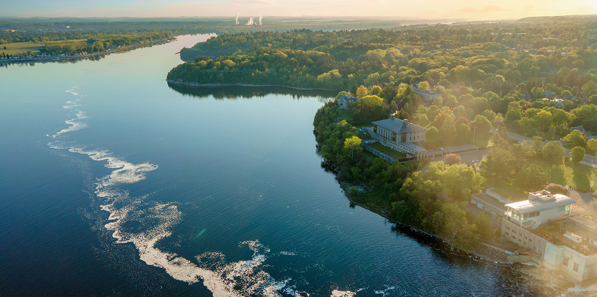 A beautiful, serene bird's eye view of a lake and surrounding forest.