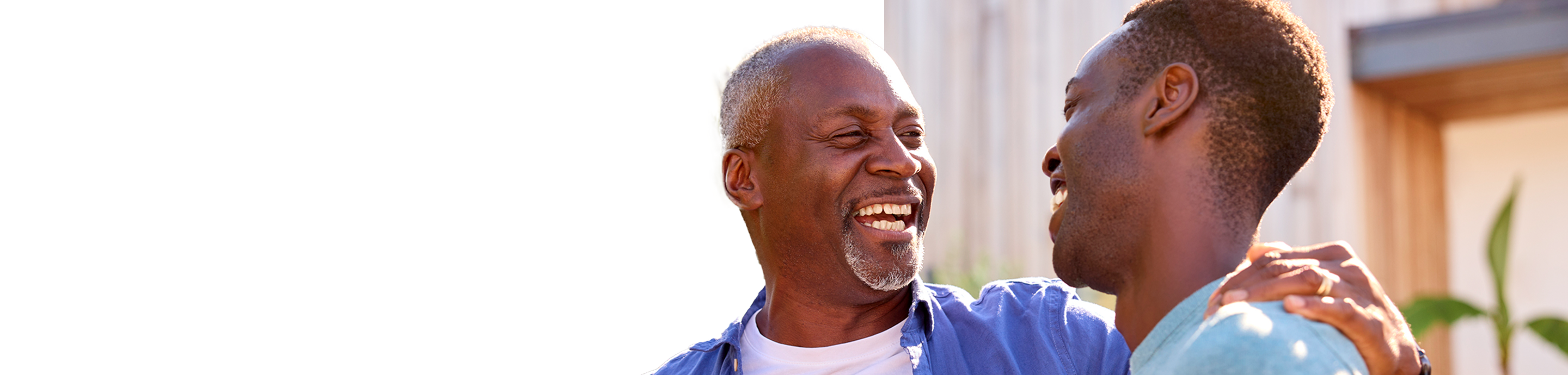 Father and son laughing together.