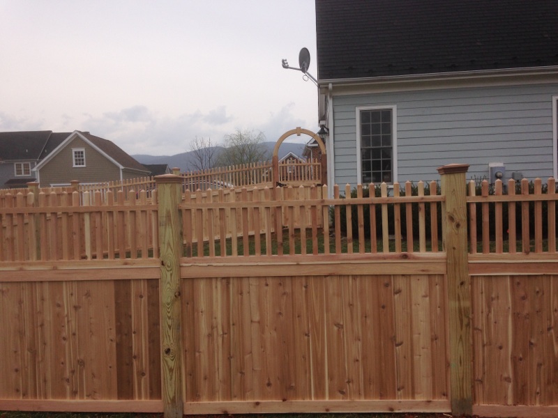 Custom Cedar fence with 2x2 topper on pressure treated pine posts