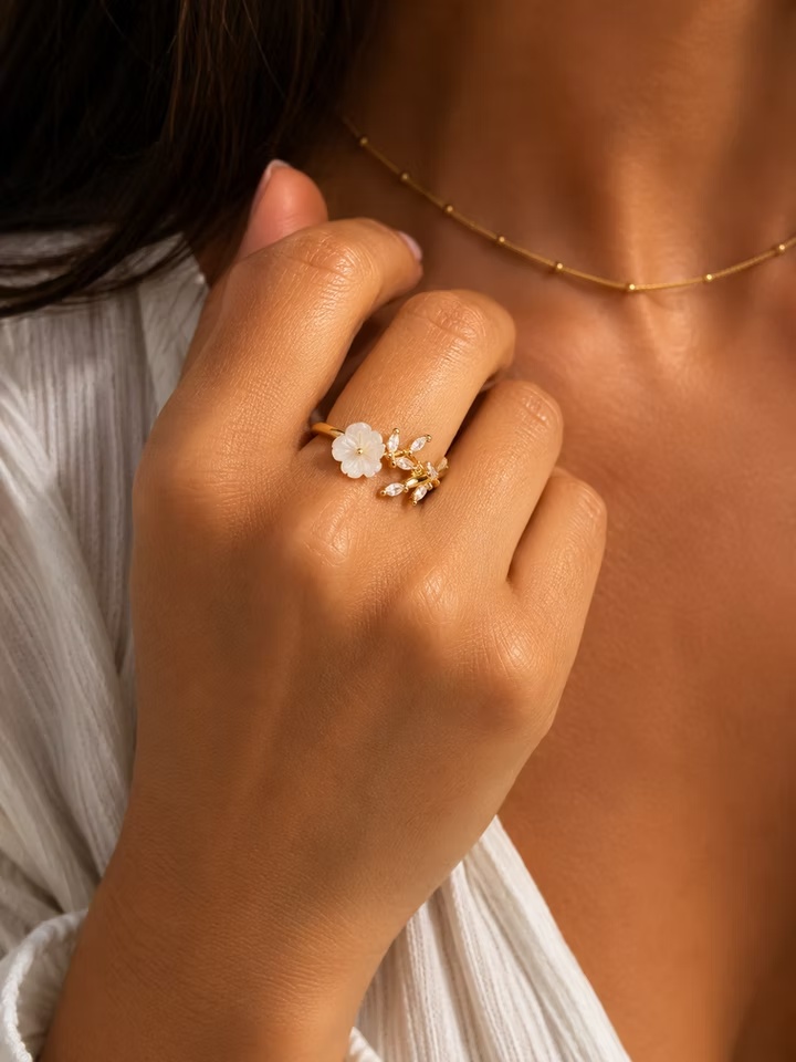 The Wildflower Wrap Ring features a nature-inspired design with graceful details, making it a versatile piece for everyday wear and special occasions.