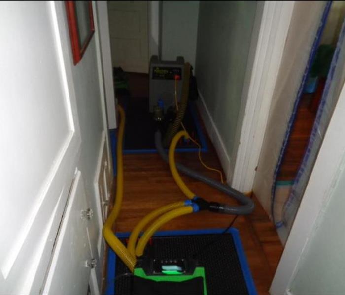 A bathroom water line broke overnight and water spill through out this homes bathroom, hallway, 2 bedrooms, and a closet. Hardwood floors can be tricky to dry but the owner was pleased that we were able to save the flooring in the home. Tech were able to make it look 