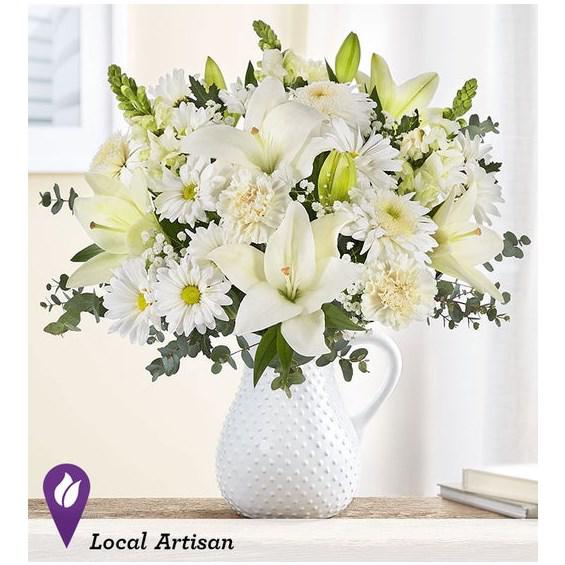Flower SongTM Bouquet By Southern LivingÂ® - Our exclusive arrangement features a pure white floral mix, gathered by hand in our Timeless Treasure pitcher: a piece that inspires nostalgia with its vintage Swiss Dot design, while adding elegance anywhere in the home.