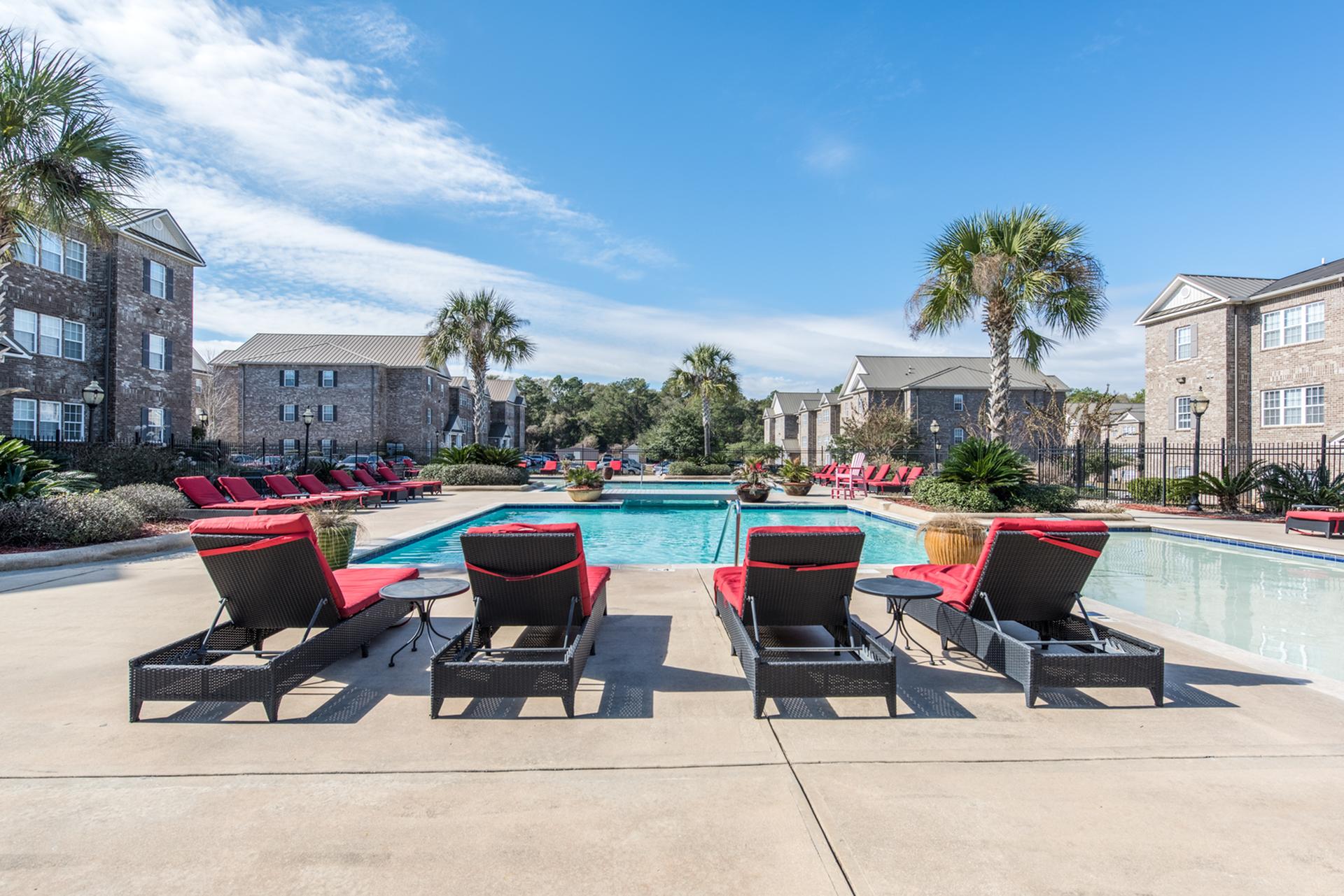 Central, outdoor pool area with plenty of lounge seating. Central House on Stadium Apartments Mobile (251)272-4710